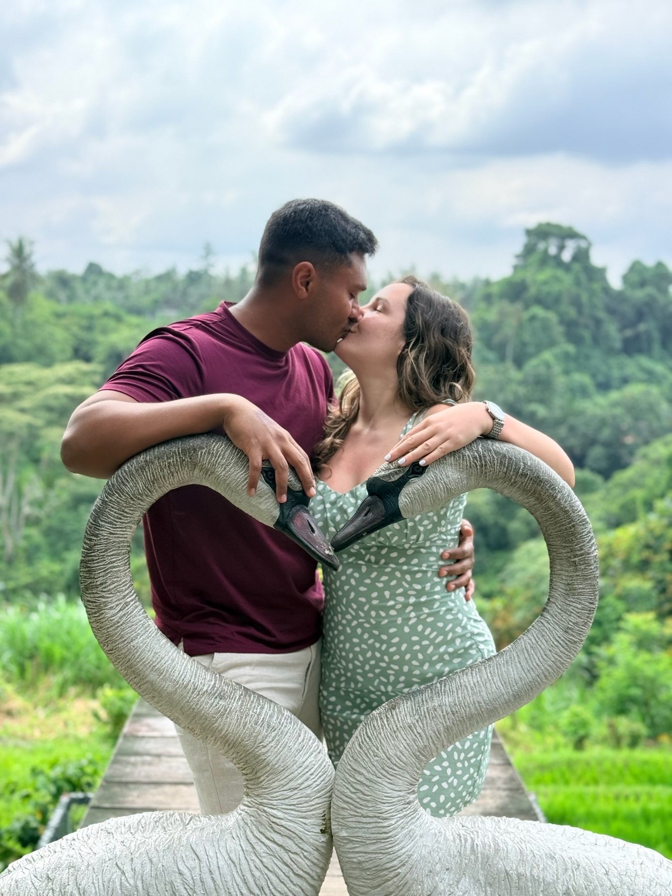 Abhishek kissing Giselle in a heart-shaped seat